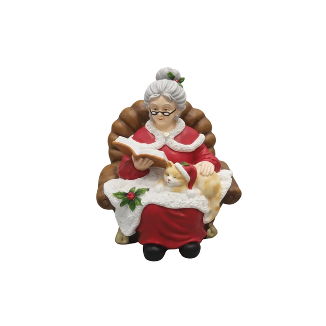 Mrs Clause sitting on chair reading 16.5x16x21cm